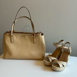 Coach handbag, ivory color. Multiple pockets.